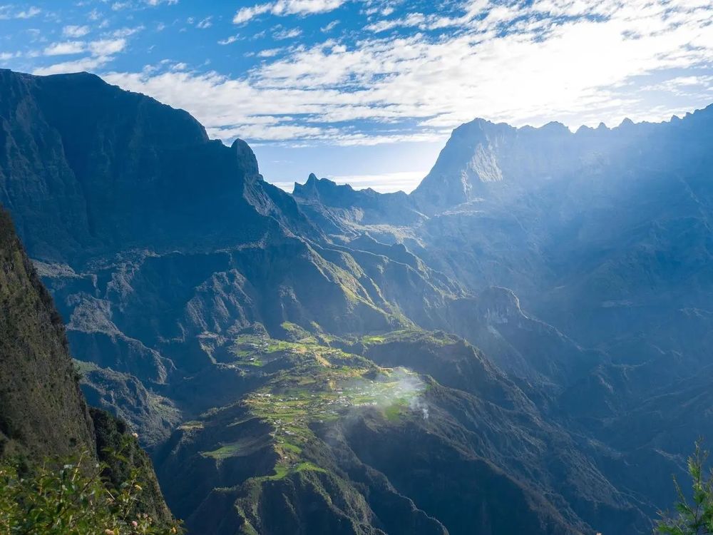 Breathtaking view of Réunion Island’s Cirque, nestled in the heart of the Indian Ocean, where rugged cliffs embrace lush valleys and timeless tranquility.