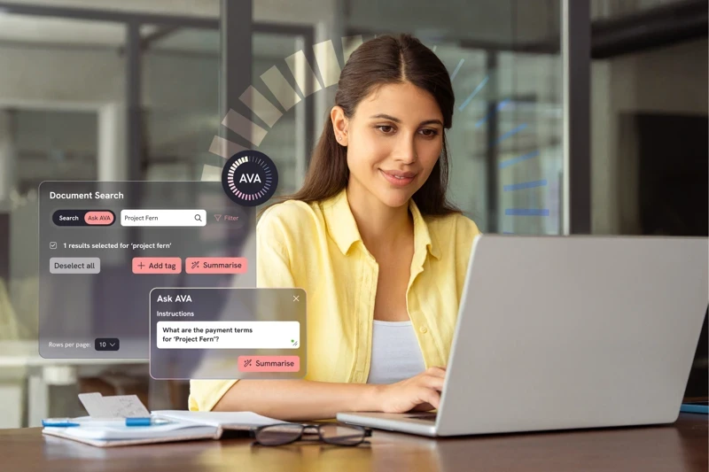 Legal professional using a laptop at a desk, with interface elements showing document search, summaries and AI-assisted legal queries.