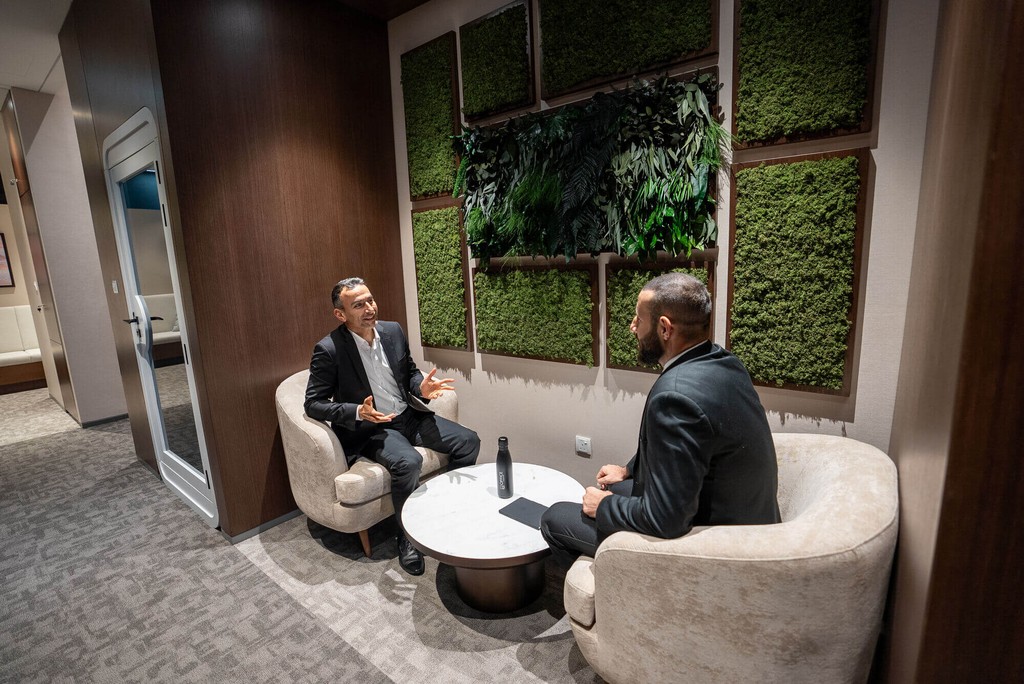 Professionals discussing corporate structuring solutions and leading pro services Abu Dhabi in a modern office.