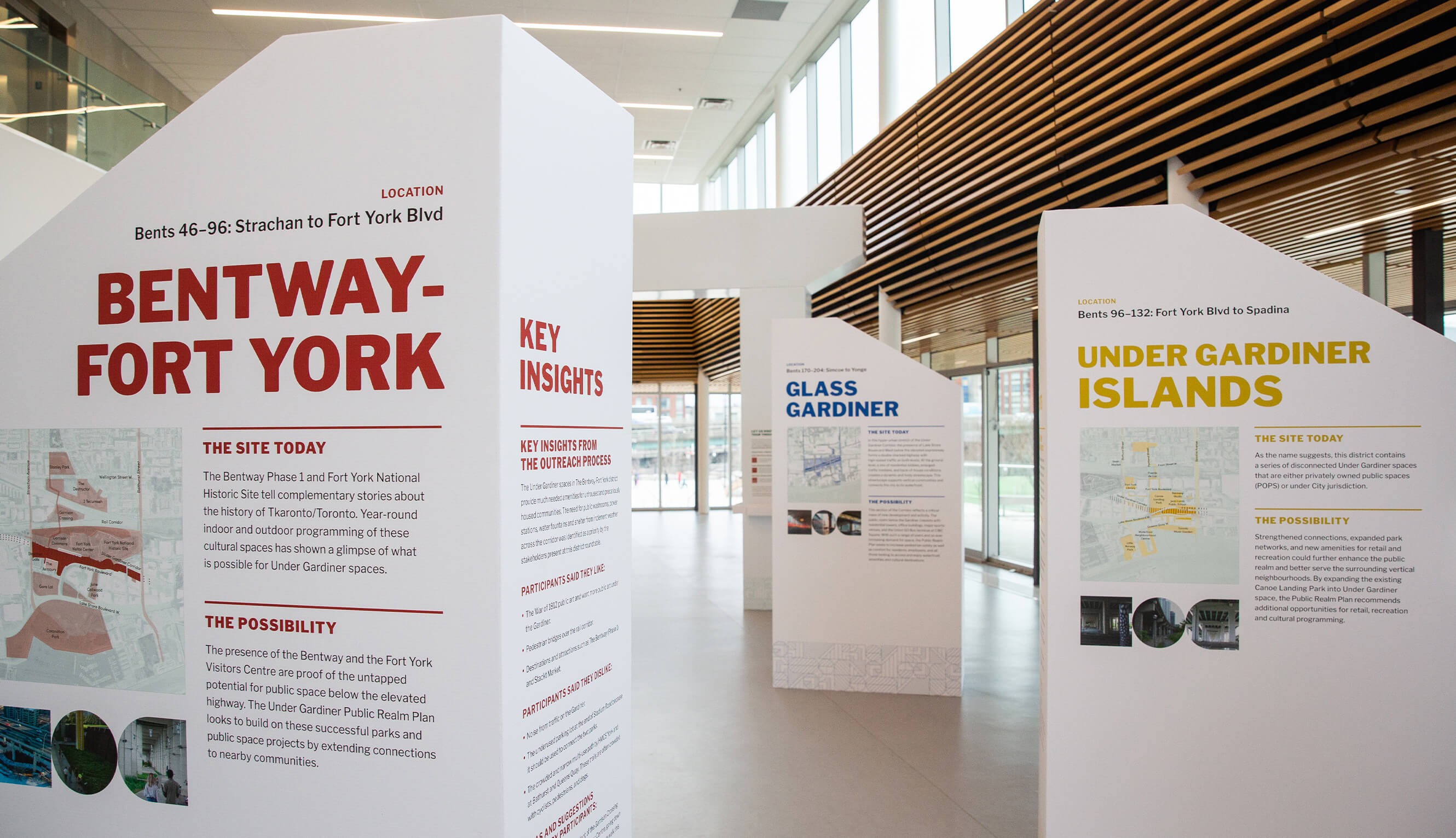 Overview of the Under Gardiner PRP Exhibit, with three tall structures containing text outlining key points of the plan in view.