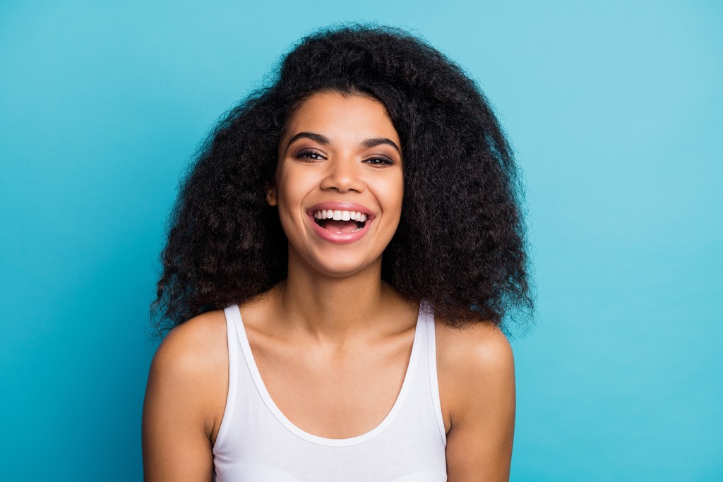 young teen girl smiling with her bright teeth