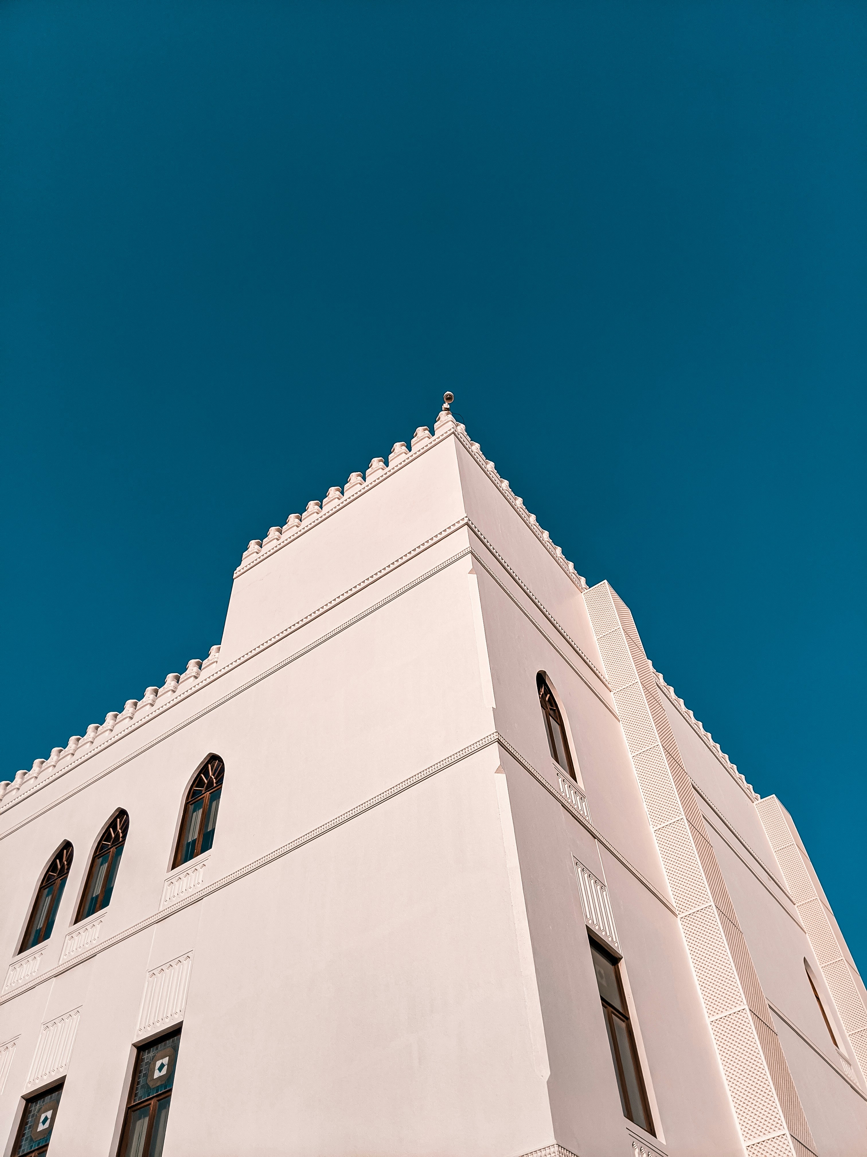 white concrete building under blue sky during daytime