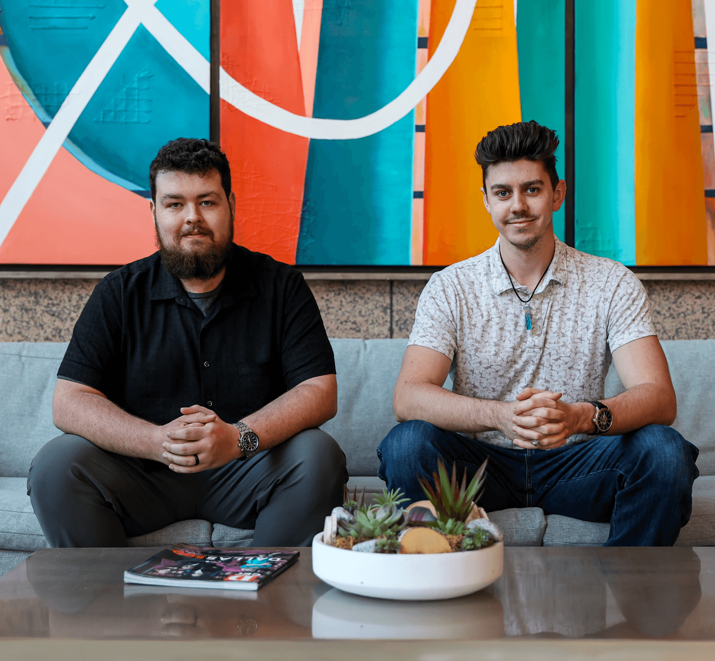 The founders of That One Tech Company sitting on a couch, Kyle Johnson (right) and Nick Spaur (left).