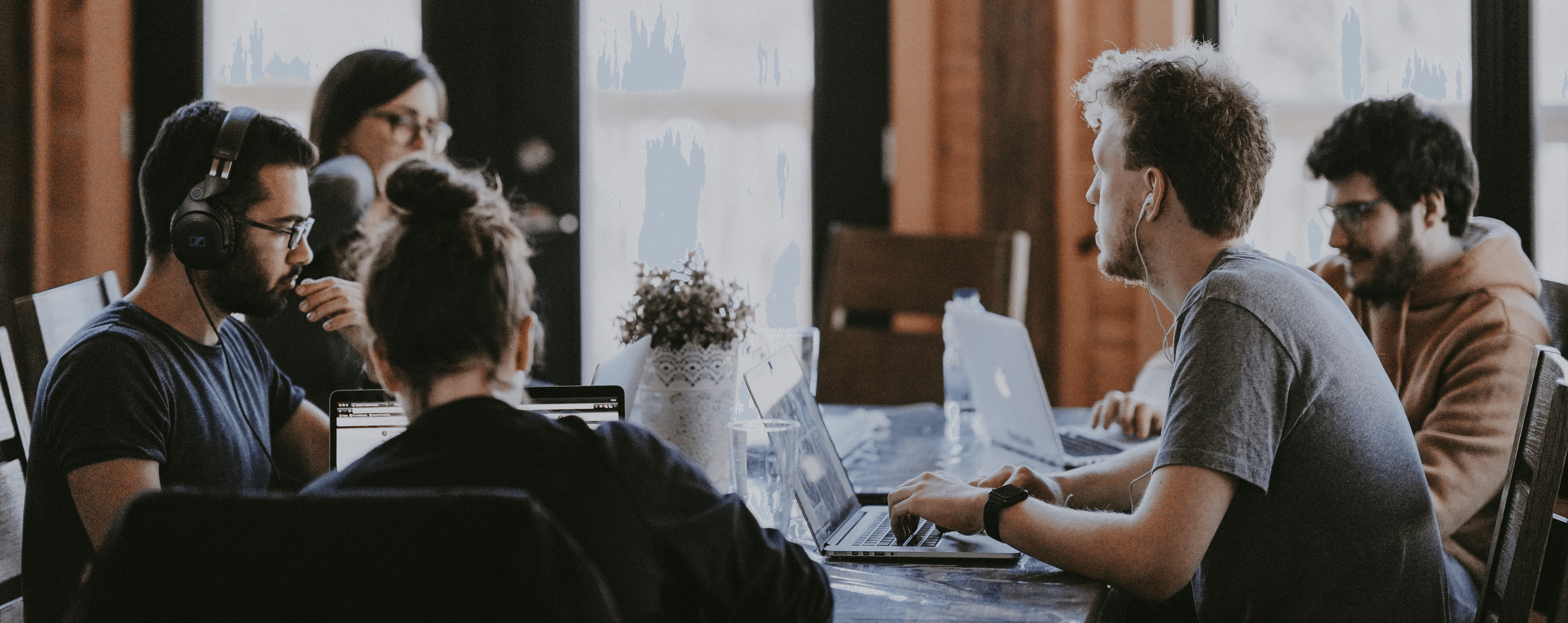 sittin people beside table inside room