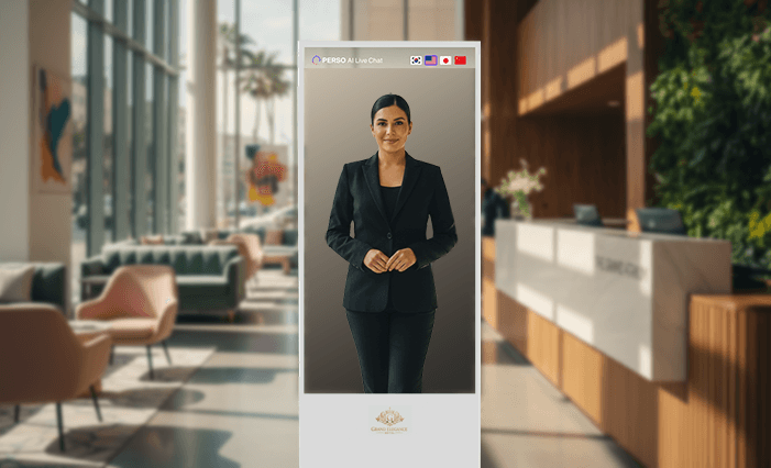 A woman in a white suit stands confidently against a bright red background, smiling with one hand on her hip.