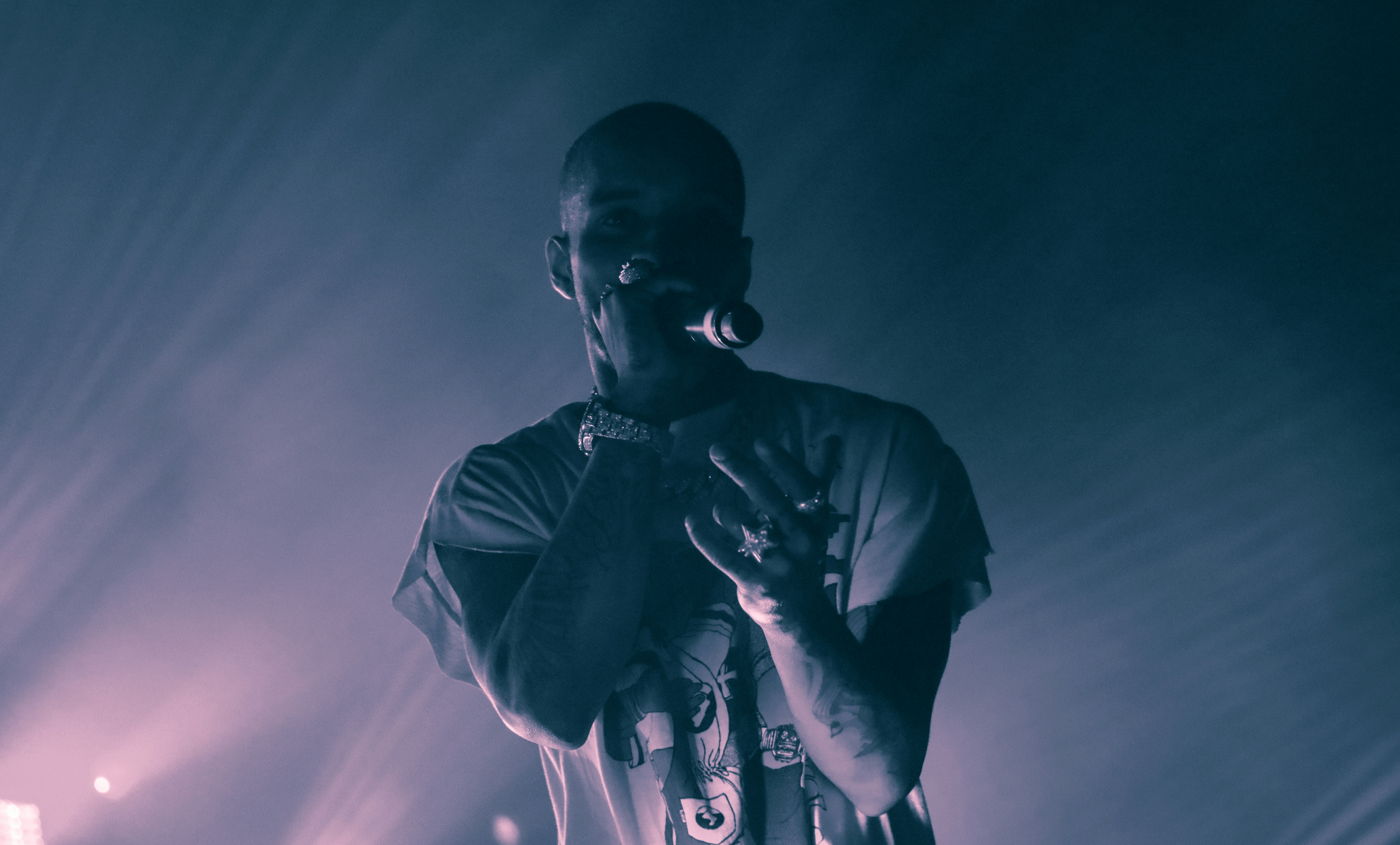 rapper on stage entertaining crowd - how to write rap songs