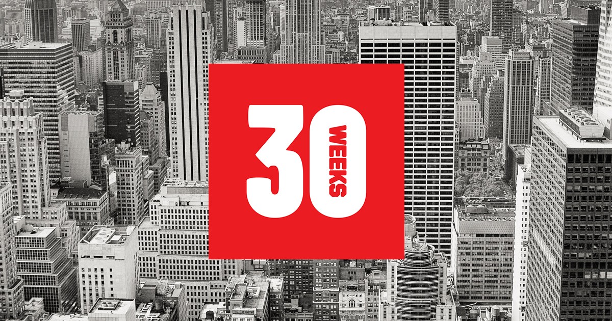 A black and white photo of New York City scape and on it a red square with a white 30 and the word weeks in it.