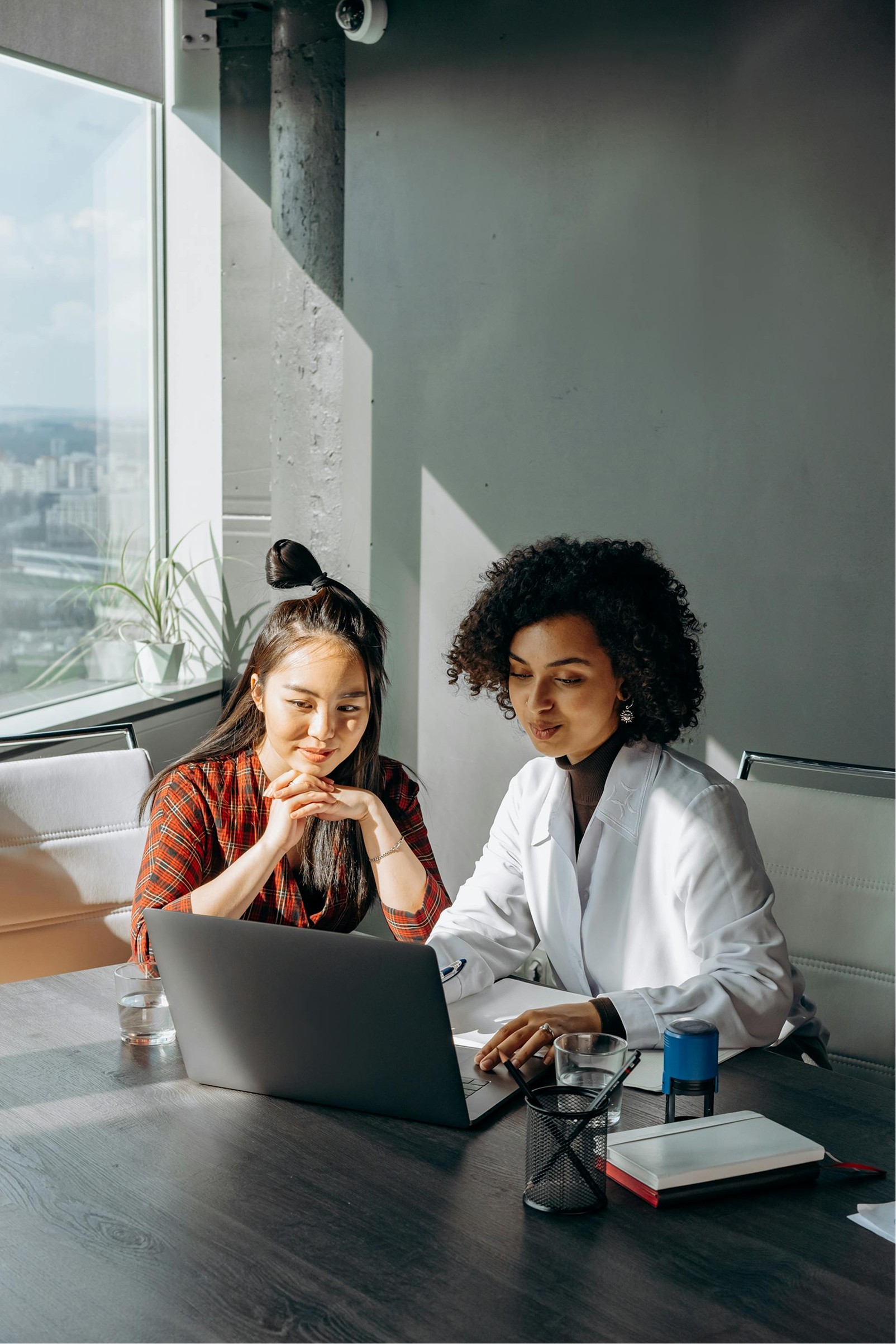 two women in front computer