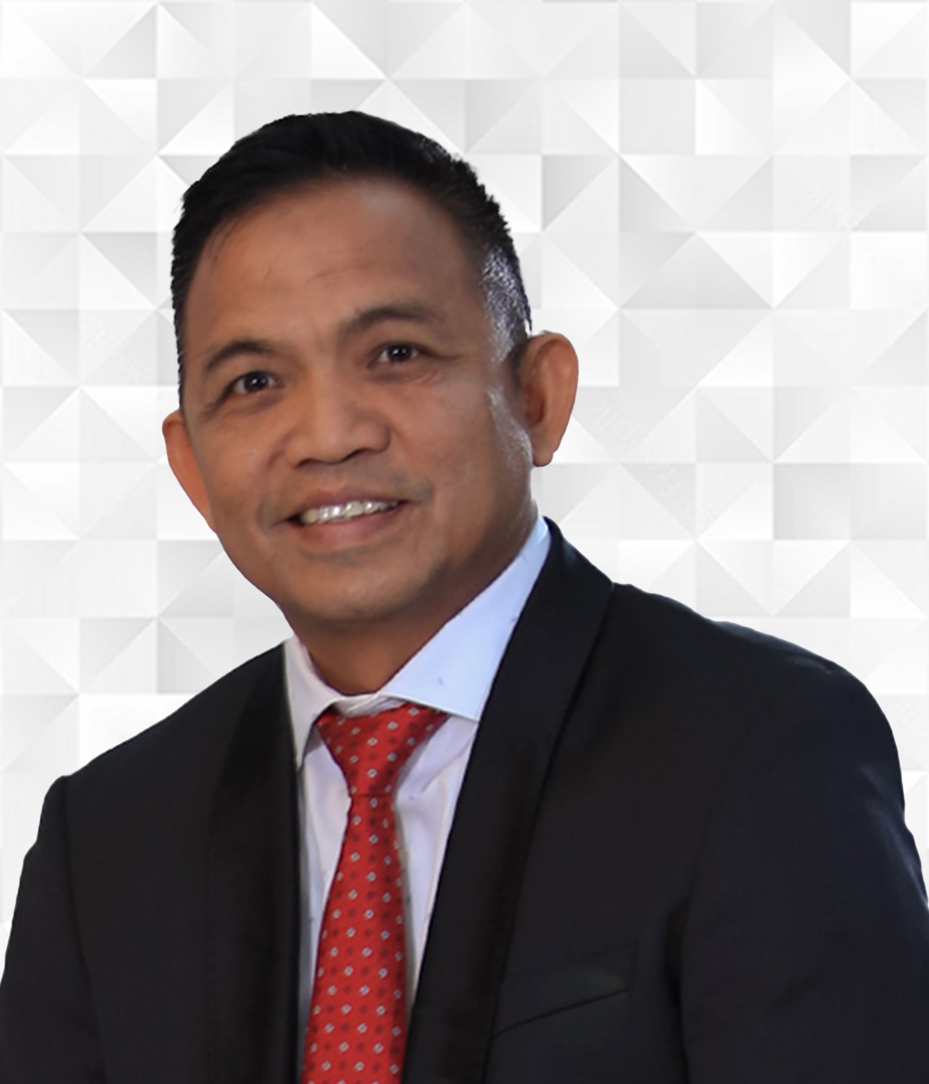 Foto portrait Direktur Bisnis collega Afrizel menggunakan jas hitam dan dasi berwarna merah