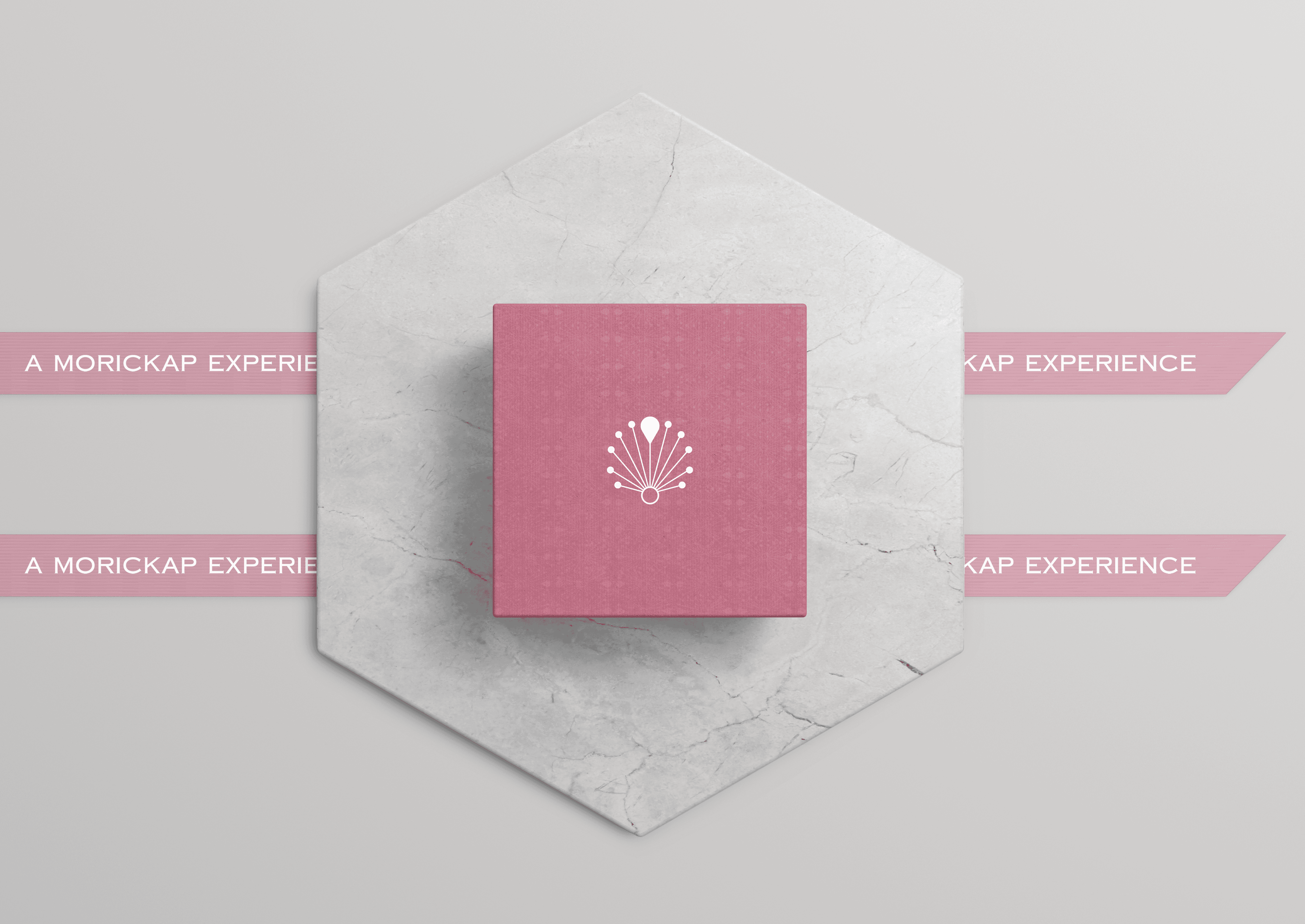 Close-up of hand holding pink ice cream cone against pastel background