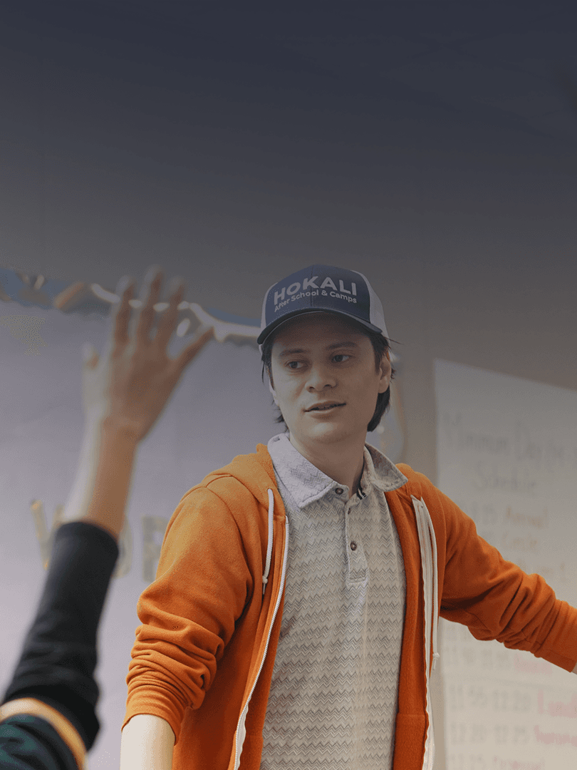 HOKALI instructor leading an engaging classroom activity with elementary students during an after-school enrichment program
