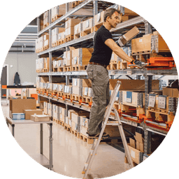 A person stocking a shelf