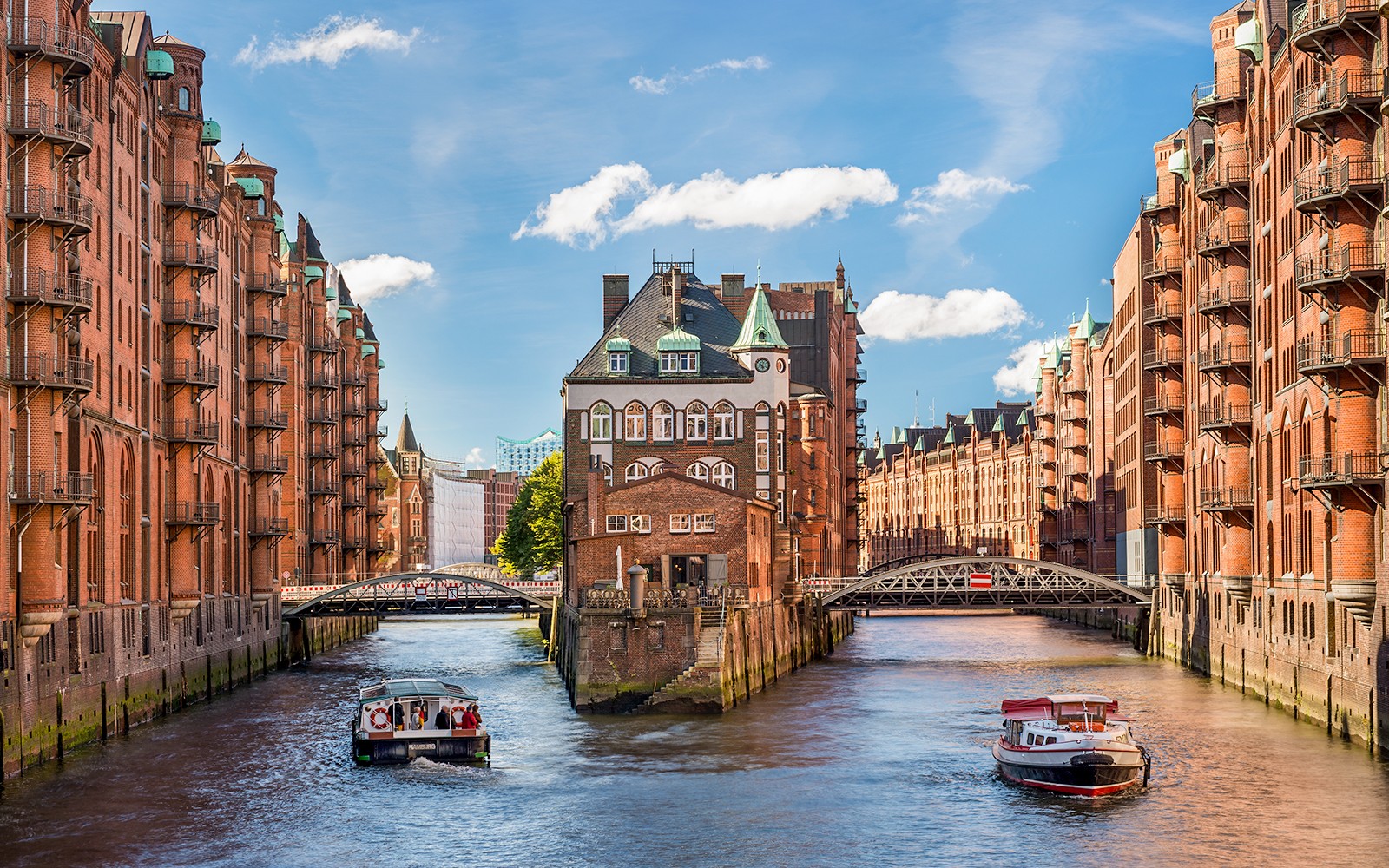 Historic Speicherstadt district with canal and boats in Hamburg, Germany.
