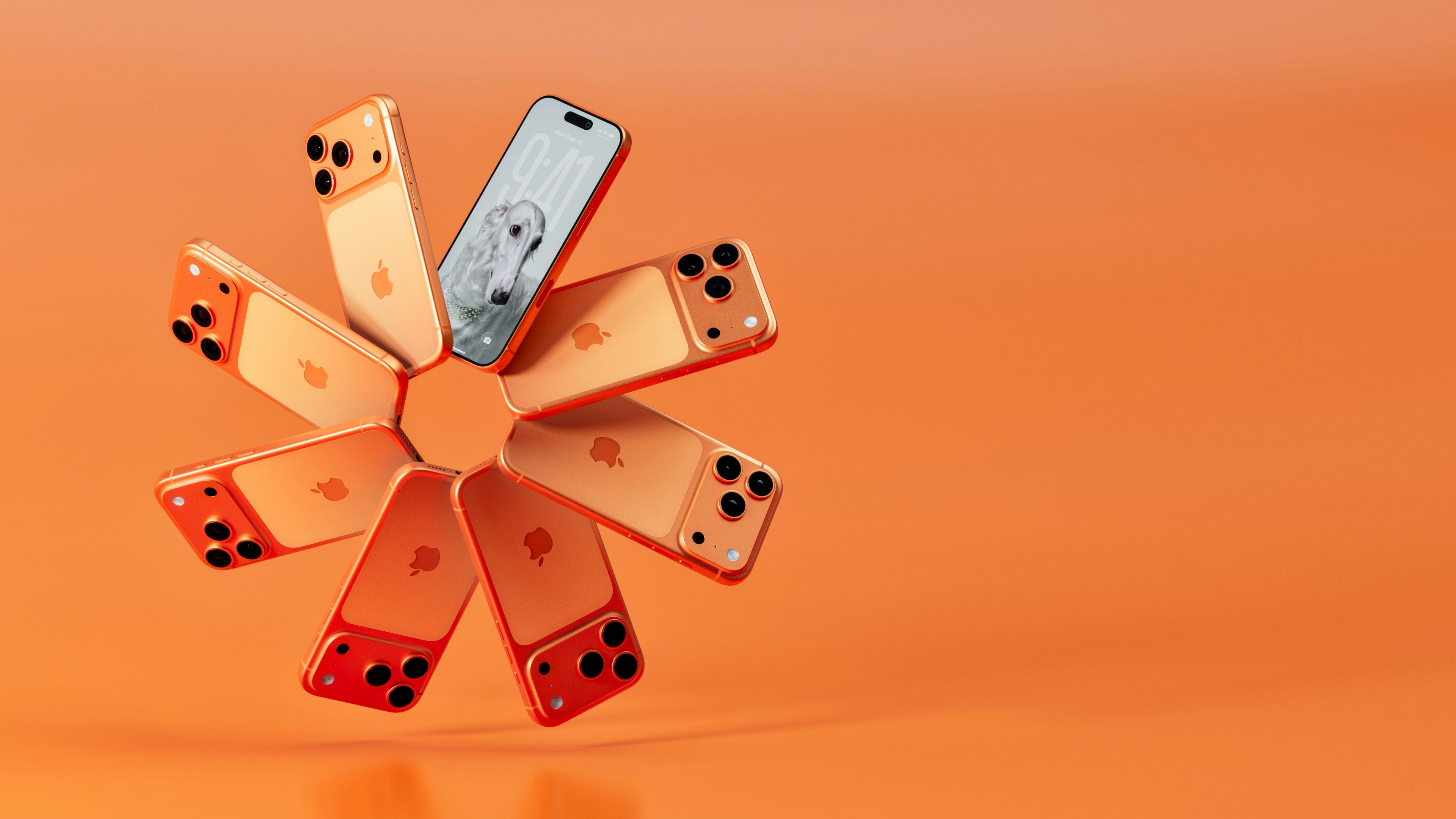 Multiple iphones arranged in a circular pattern on orange background.