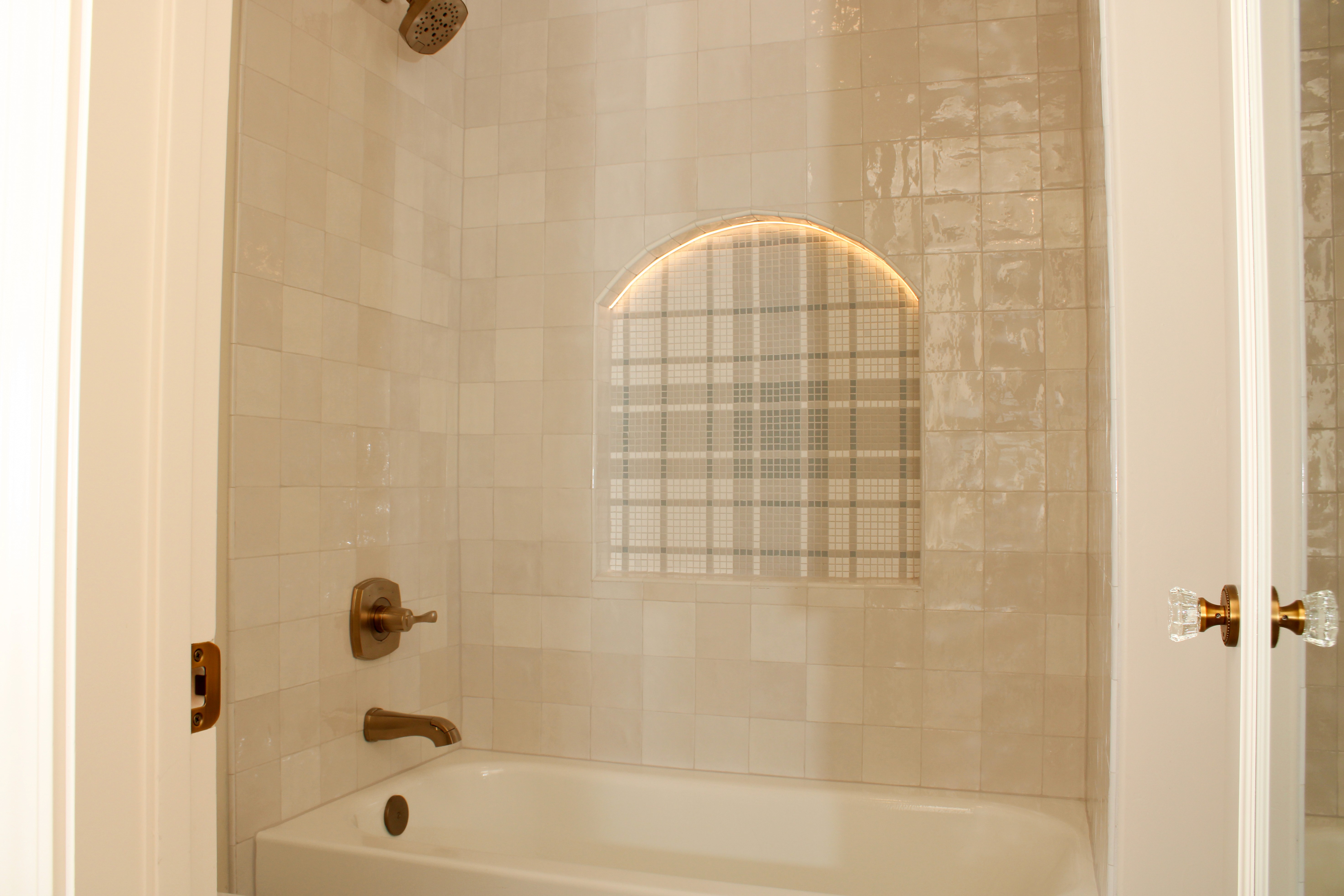 Bathroom with arched tile niches and modern finishes in a custom home in St. George, Utah.