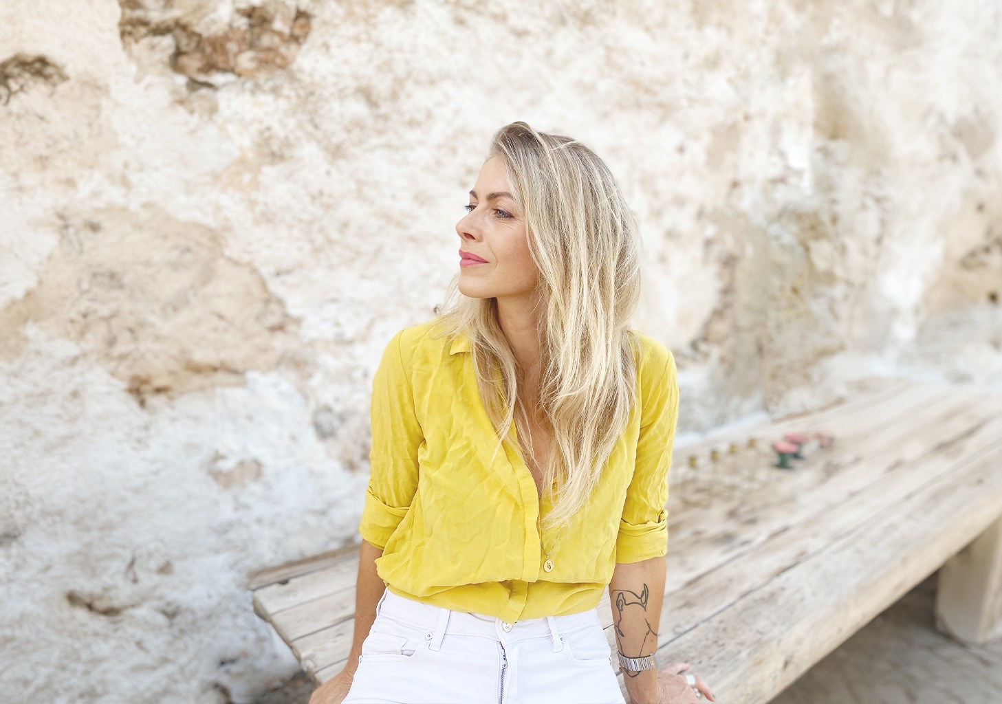 Image of beautiful woman with blond hair looking away from camera