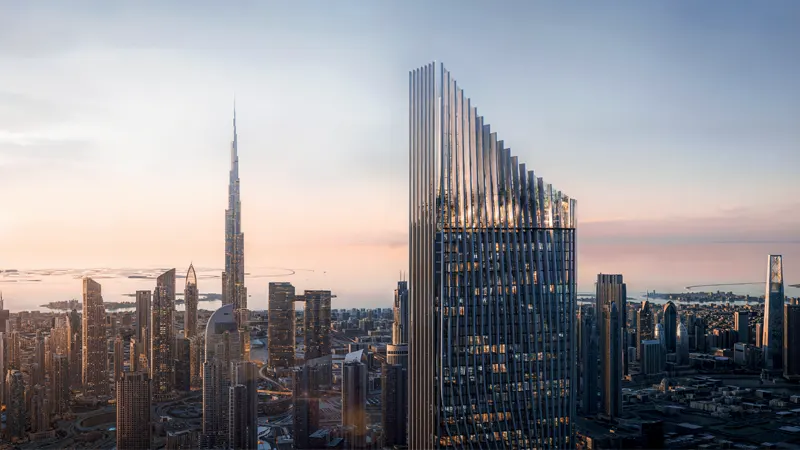 A tall structure stands in front of a cluster of skyscrapers, illustrating the skyline of Tiger Downtown.