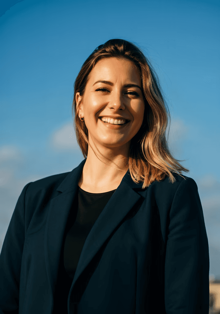 Woman in black dress smiling