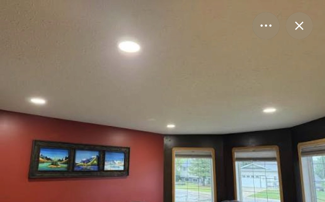 Finished basement ceiling with installed recessed pot lights