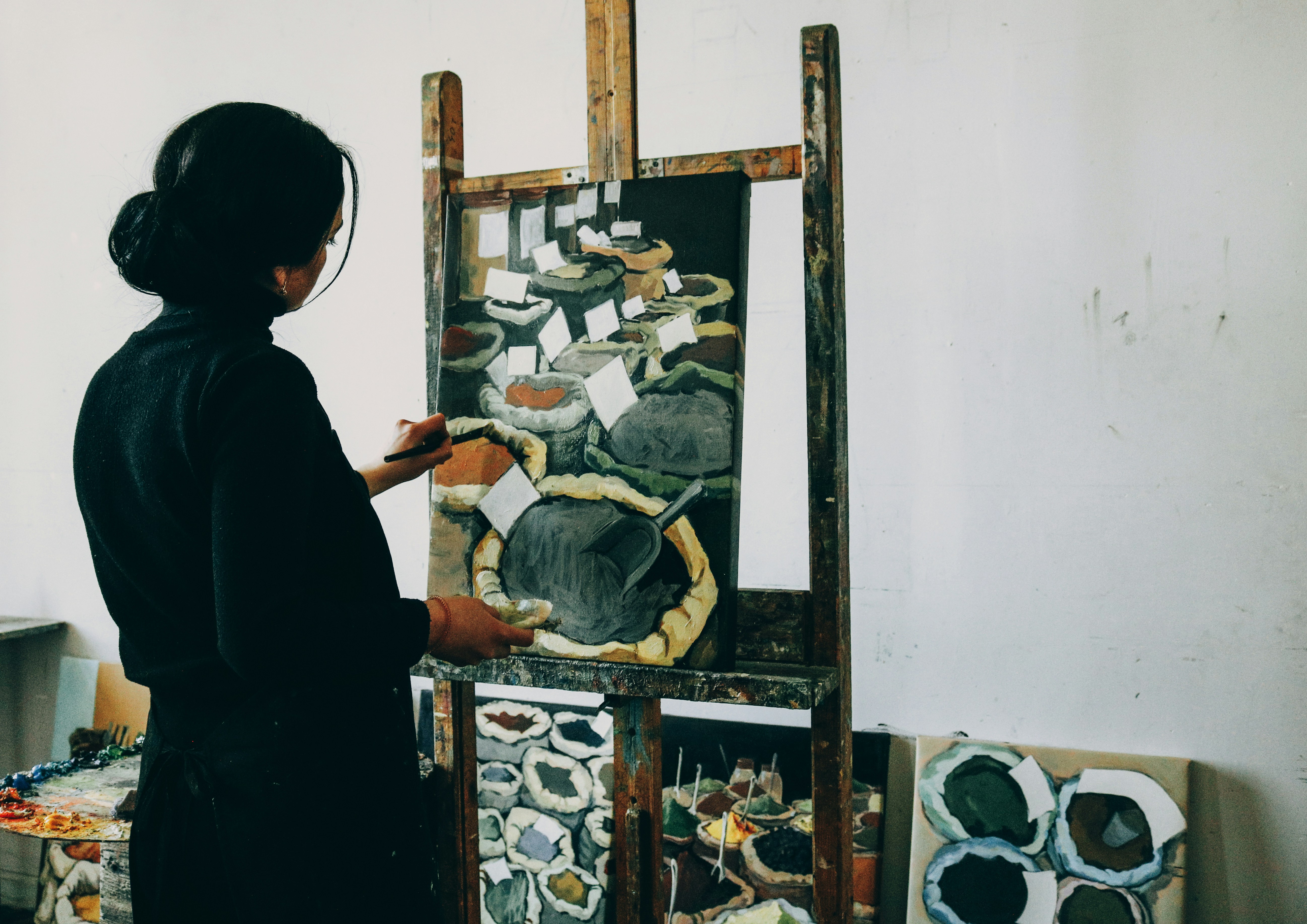 woman in black shirt standing in front of mirror