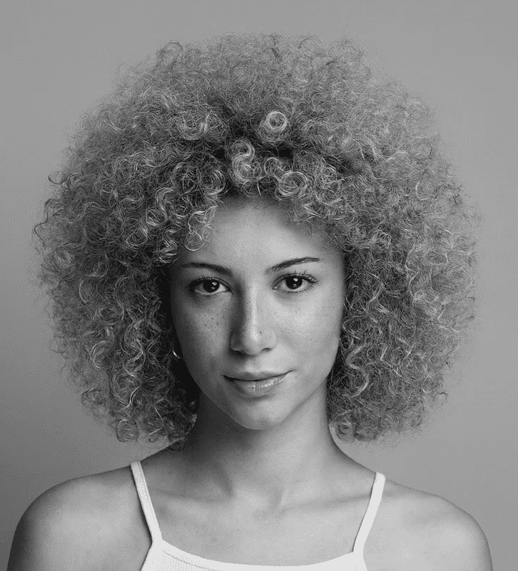 a blurry photo of a person standing in front of a wall