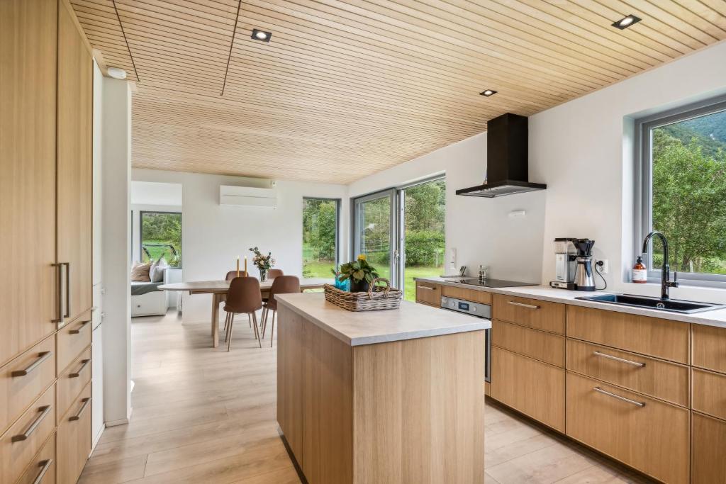 Dining room with glass table and beige chairs