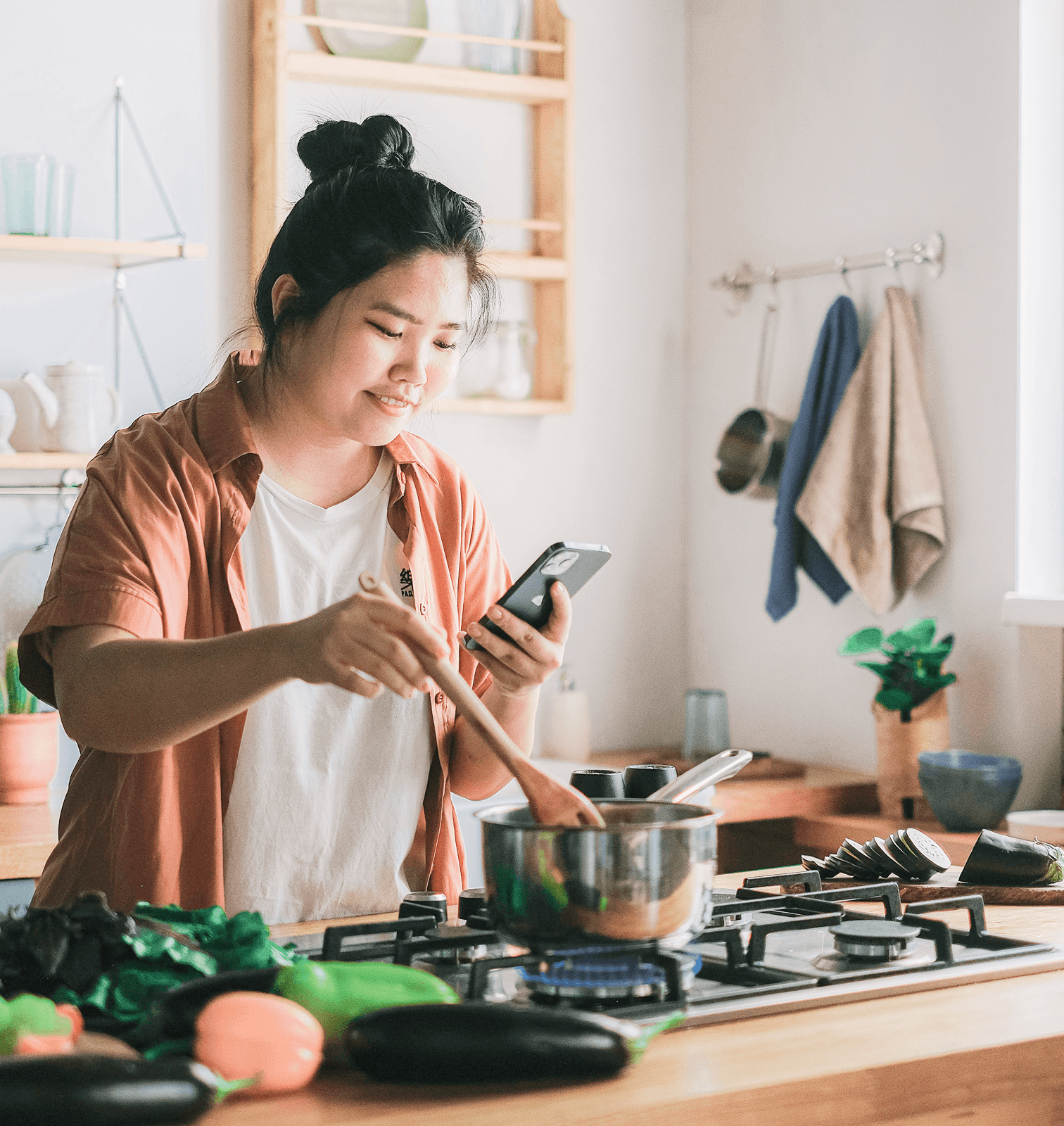 Woman looking at recipe while cooking
