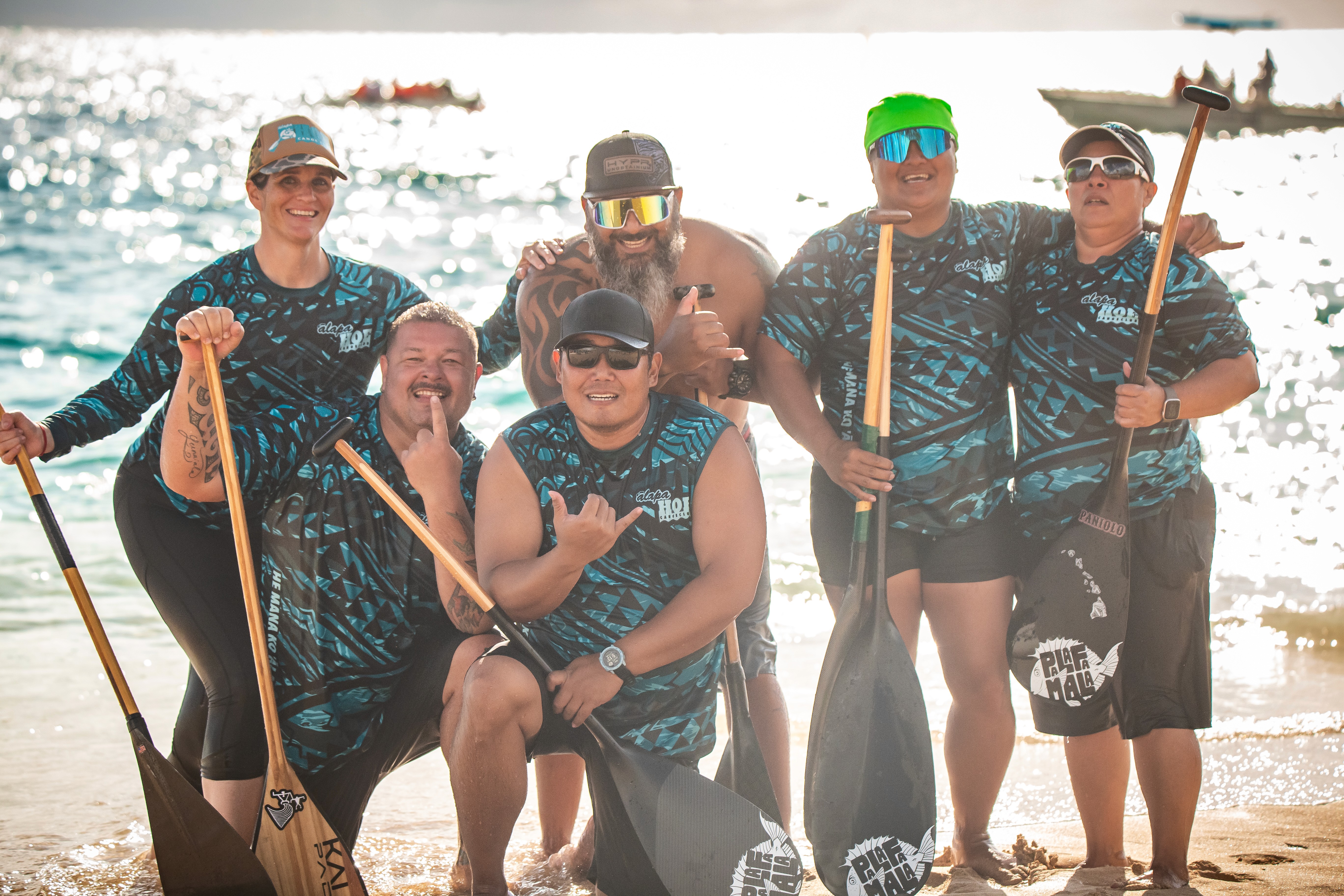 A man stading with Surfboard