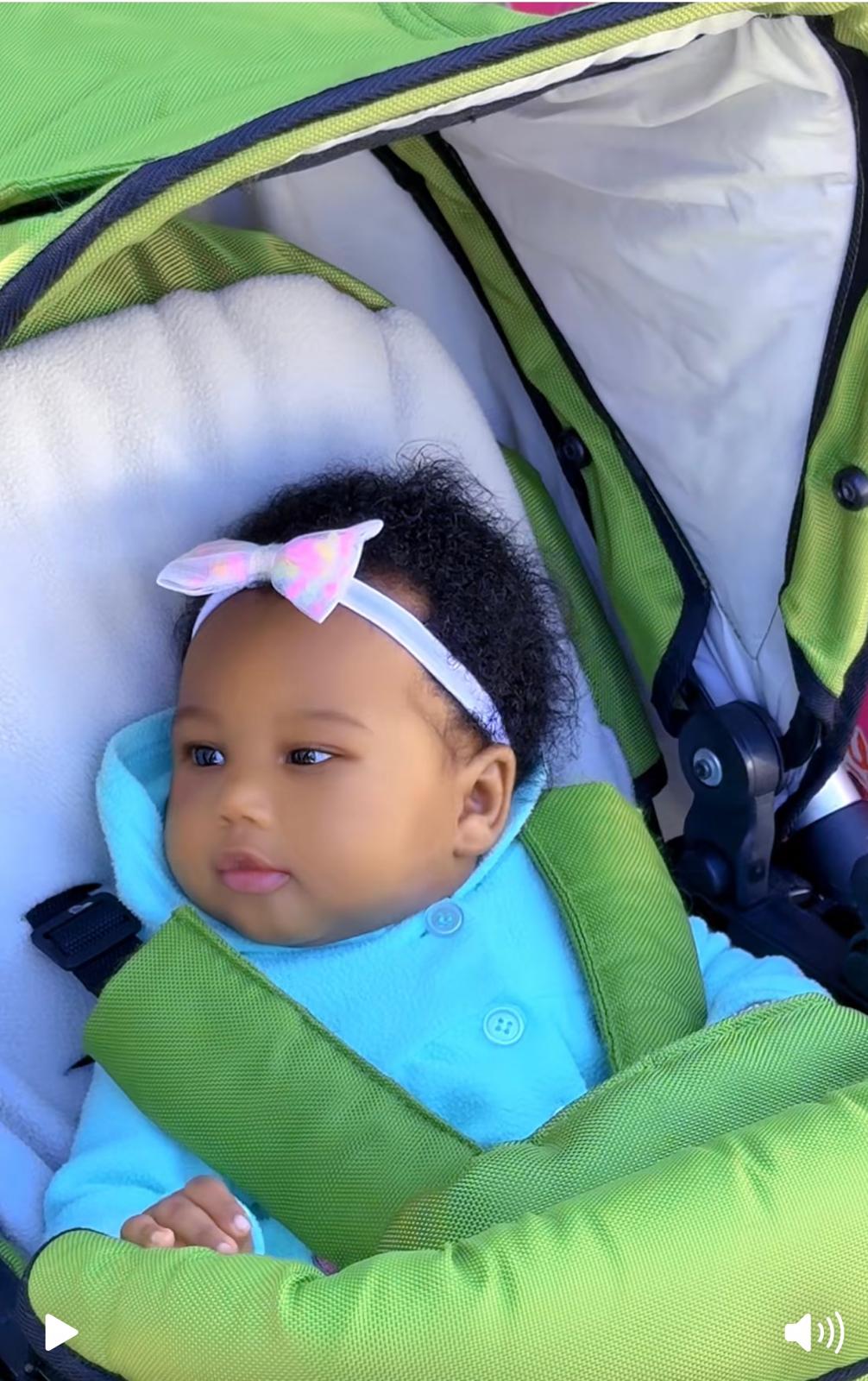 smiling toddler wearing white Champion pullover hoodie