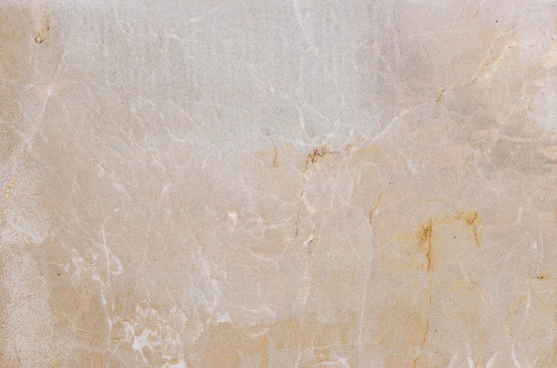 A slab of classic Travertine, showcasing its unique porous texture and warm, earthy tones.