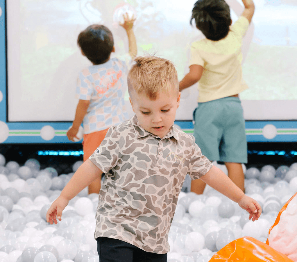 Kid playing in interective game.