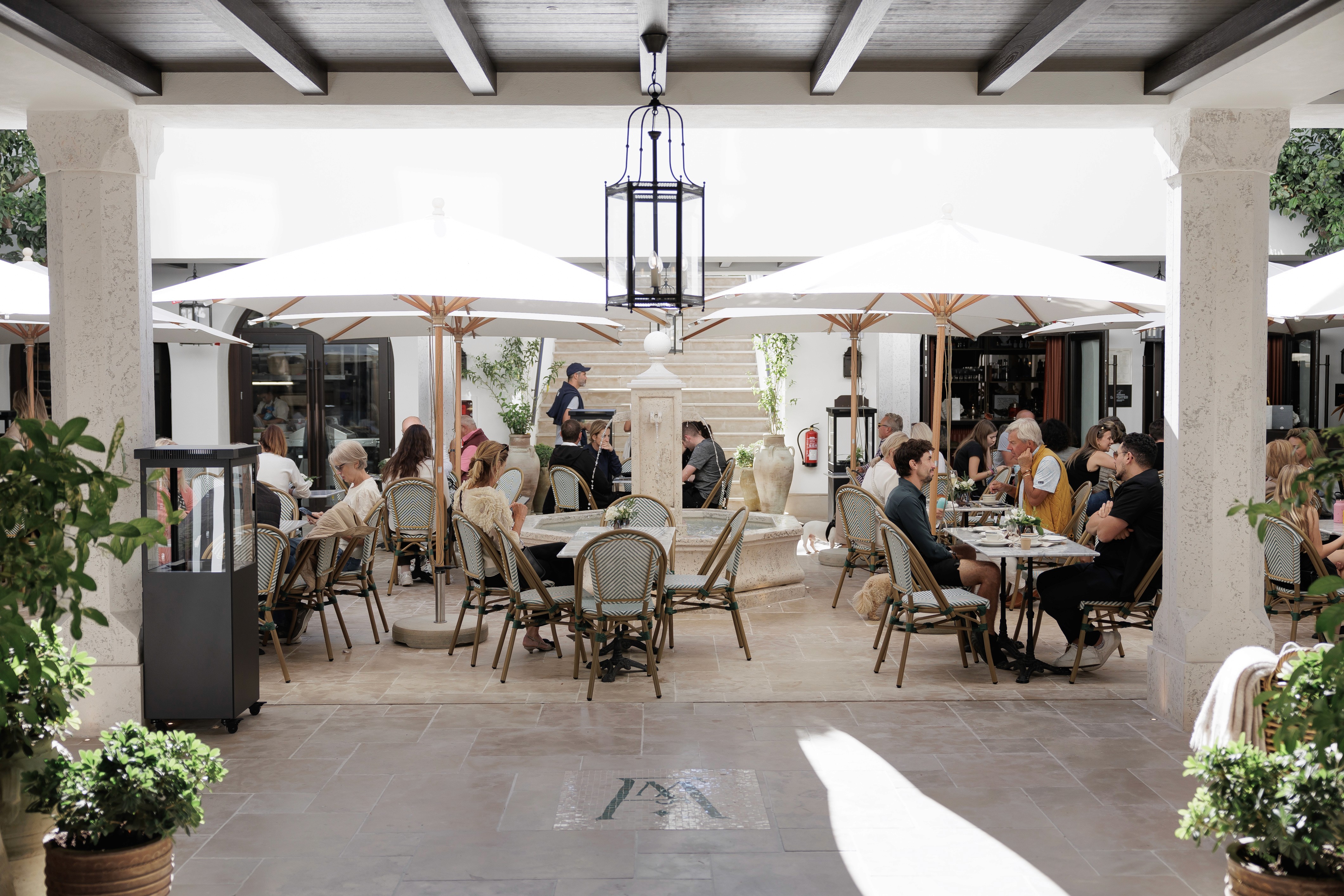 wide aerial view of a coastal mediterranean modern villa