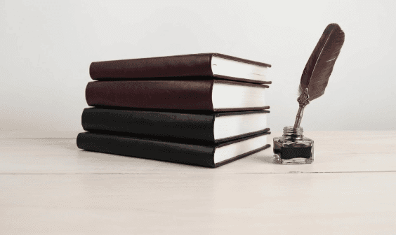 book lot on black wooden shelf