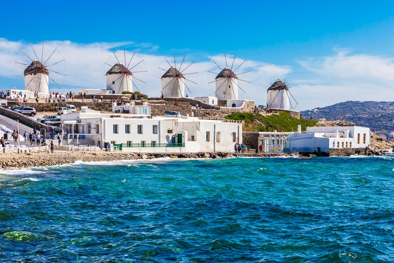 View of Mykonos windmills by the Aegean Sea, symbolizing Prepared Travel’s custom luxury, allergy-friendly honeymoons and retreats.