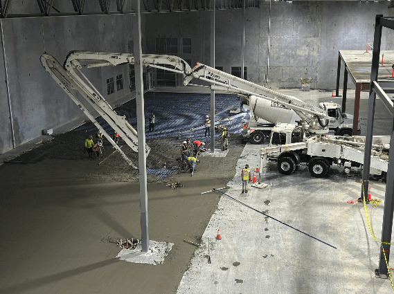 QBS Construction equipment operating at an industrial facility construction site