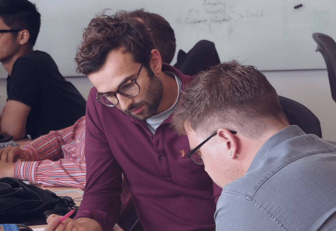 Tom and colleague Anders working in office
