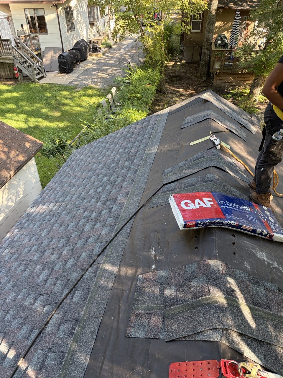 New architectural shingles going down over the fresh roof deck