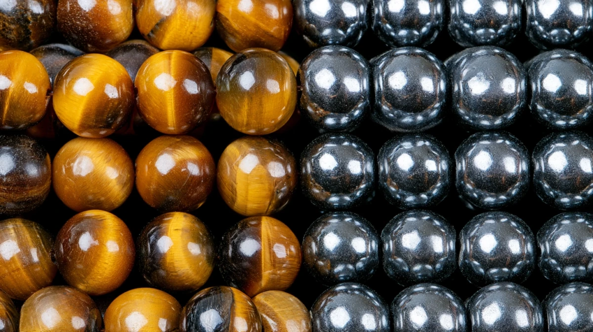 Close-up of Tiger's Eye and Hematite beads showing their texture and luster.