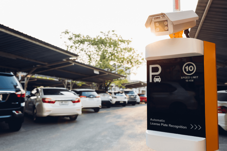 Secure off-street parking with access control and cameras for apartment residents.