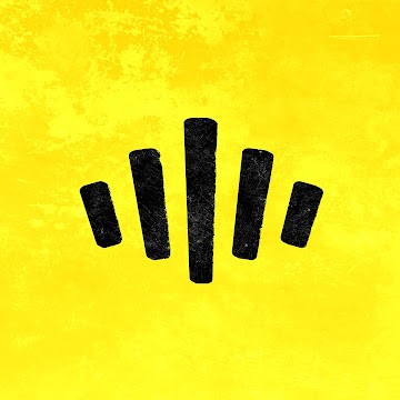 Black and white portrait of a man with a beard and glasses