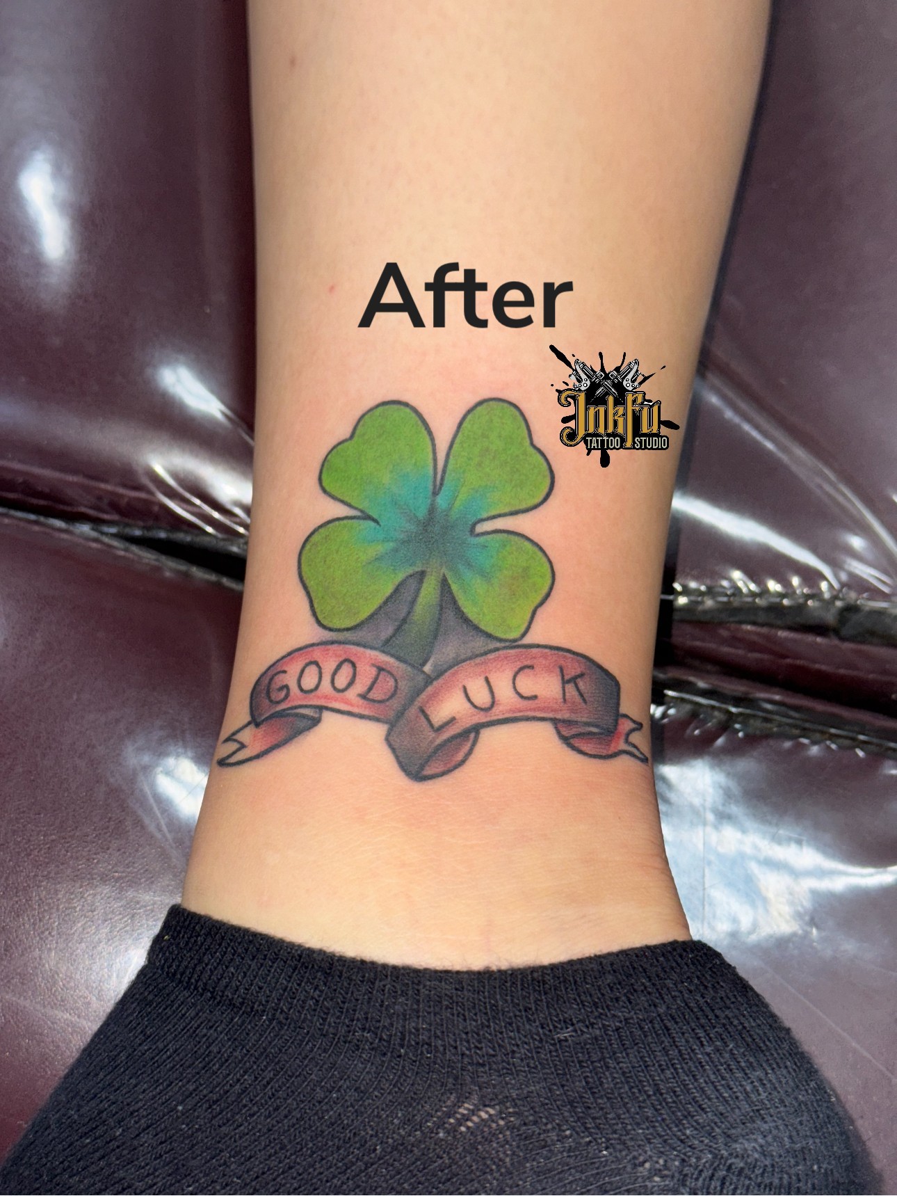 Color four-leaf clover tattoo with banner on the ankle, by Meer Rich