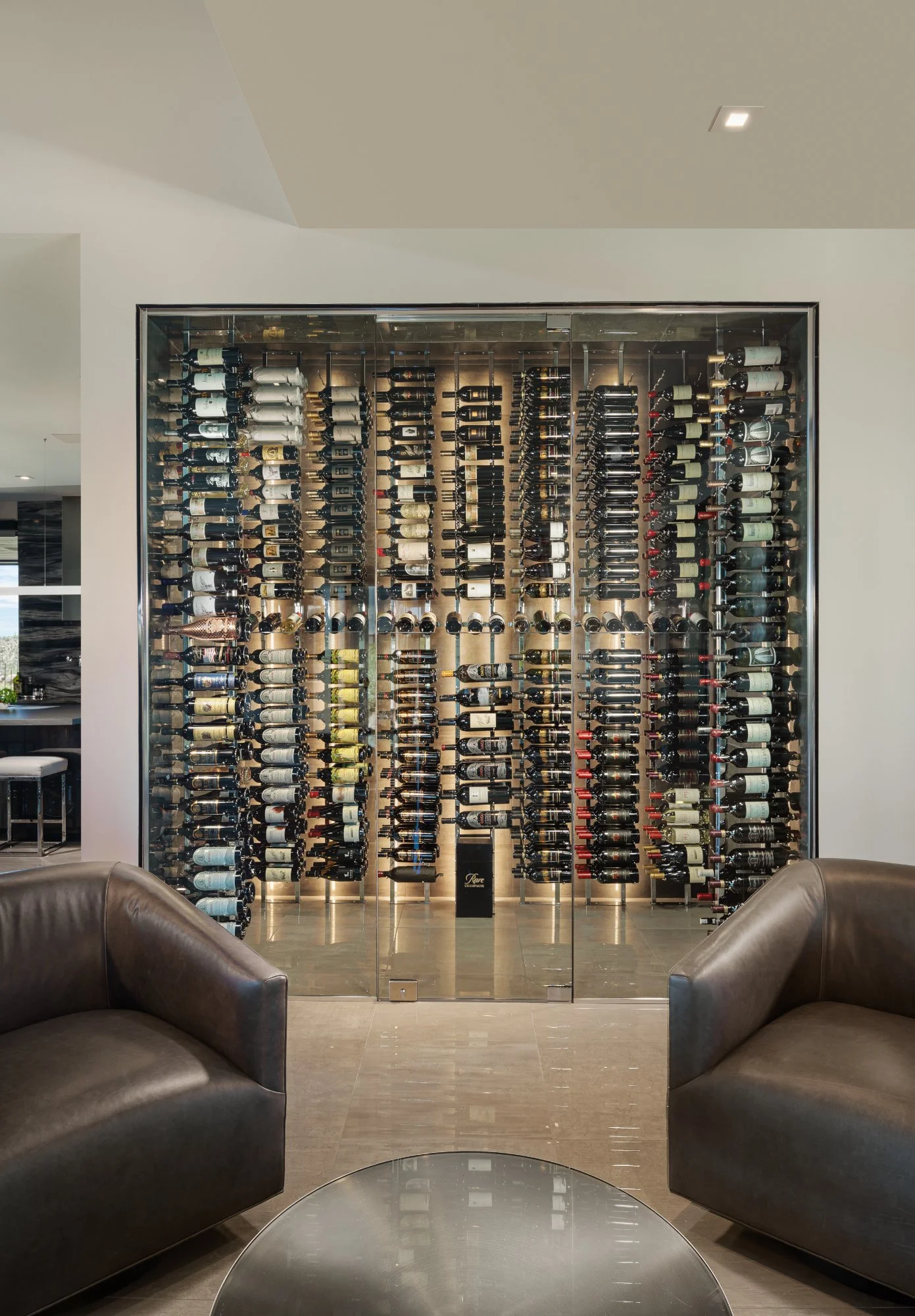 nfinity pool blending into the ocean view, minimalist sun loungers in soft neutral fabric, curved architecture