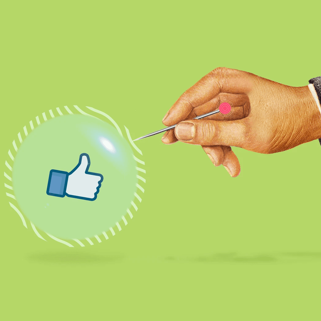 Mano con aguja a punto de reventar burbuja con ícono de "me gusta".