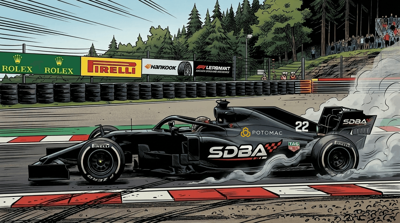 A high-speed action photograph of a black formula racing car speeding along an asphalt race track, with light smoke rising from its rear tires. The car features a prominent sleek aerodynamic design, an open cockpit, and a large rear spoiler. Several sponsorship logos are visibly printed on its matte black chassis, including a large white "SDBA" with a checkered flag graphic on the side pod, "MY ADVISOR" on the forward nose section, a golden logo for "POTOMAC", and the number "22" near the engine cover. The background shows a multi-layered guardrail barrier lined with corporate advertising banners (such as Rolex and Pirelli) against a dense wall of green trees under an overcast sky.