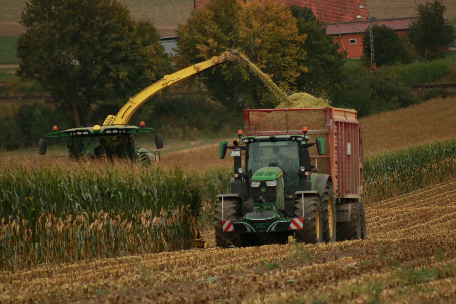 Tractor harvesting crops in a field