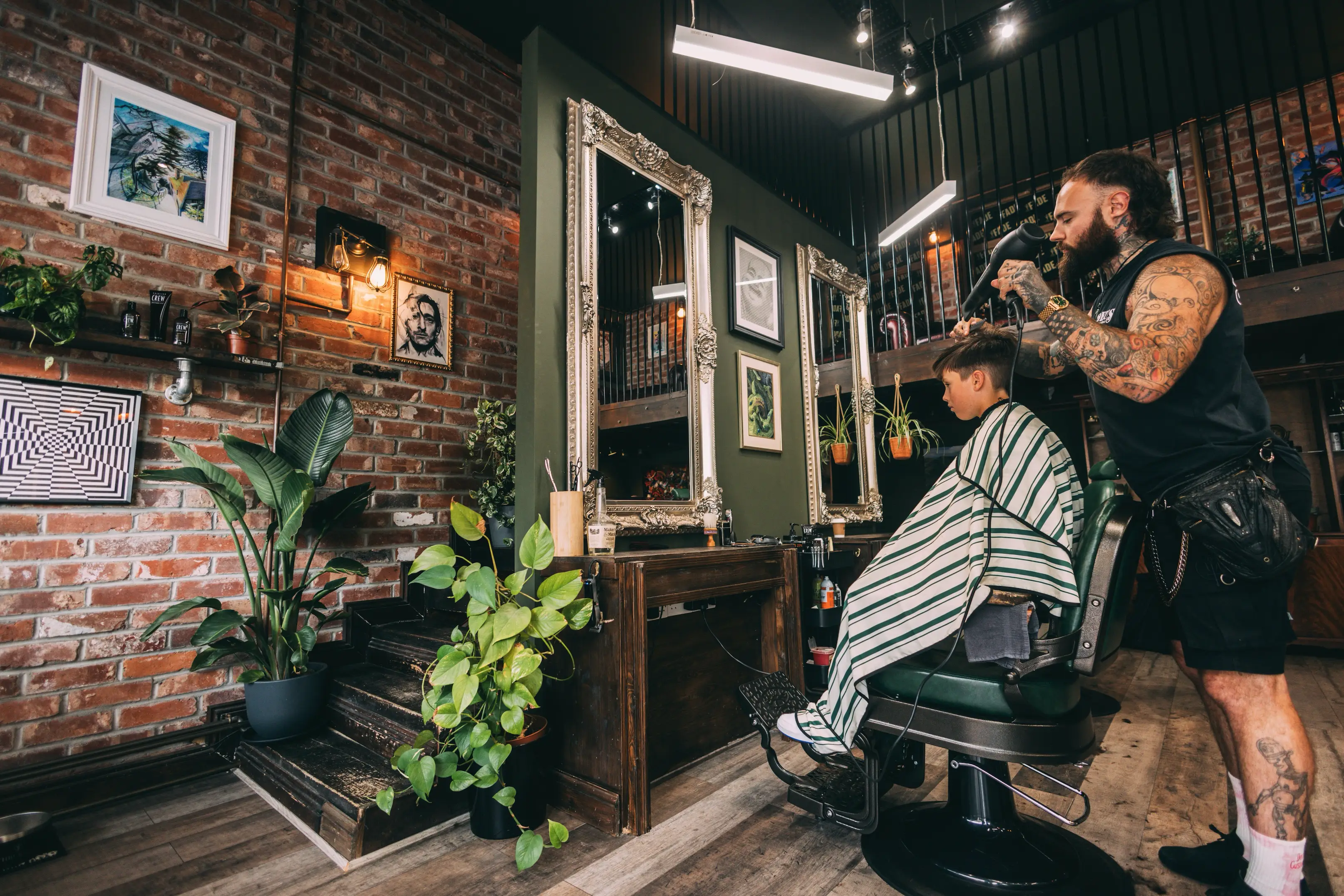Young boy having his hair cut