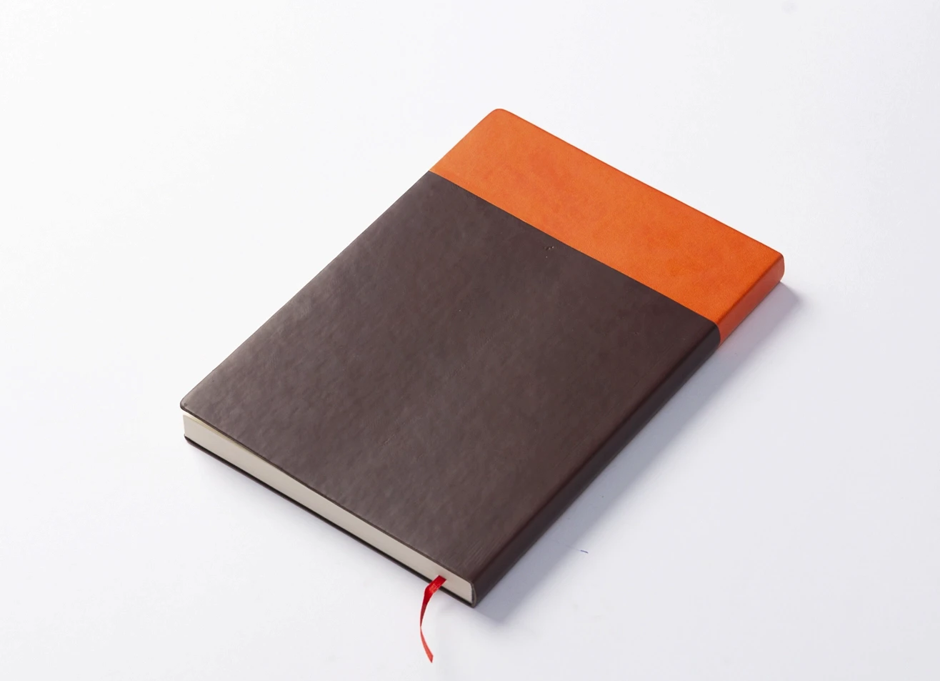 Back view of notebook showing orange and brown color split.