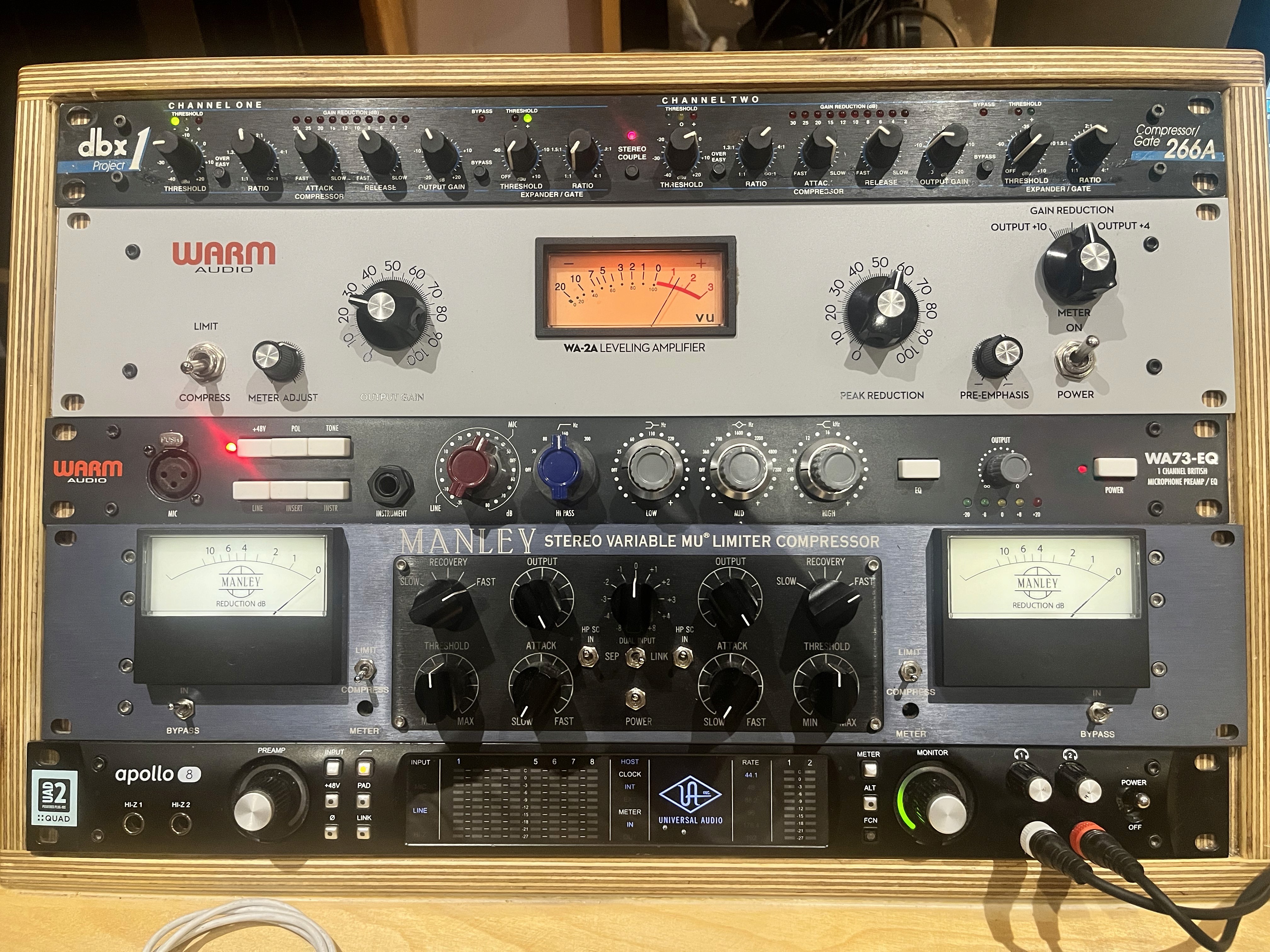 Close-up of outboard audio equipment and studio compressors.