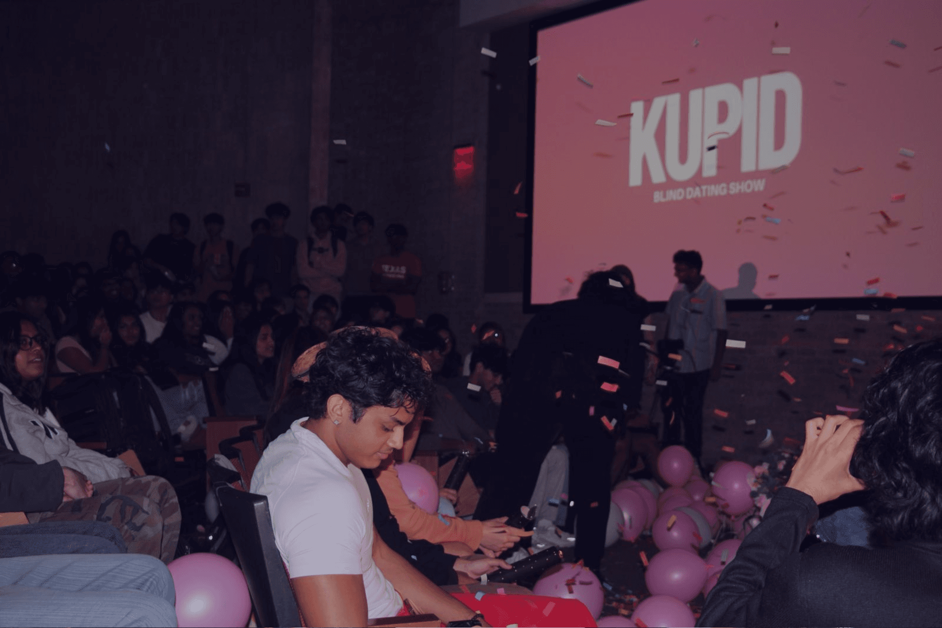 People sitting and listening to a speaker