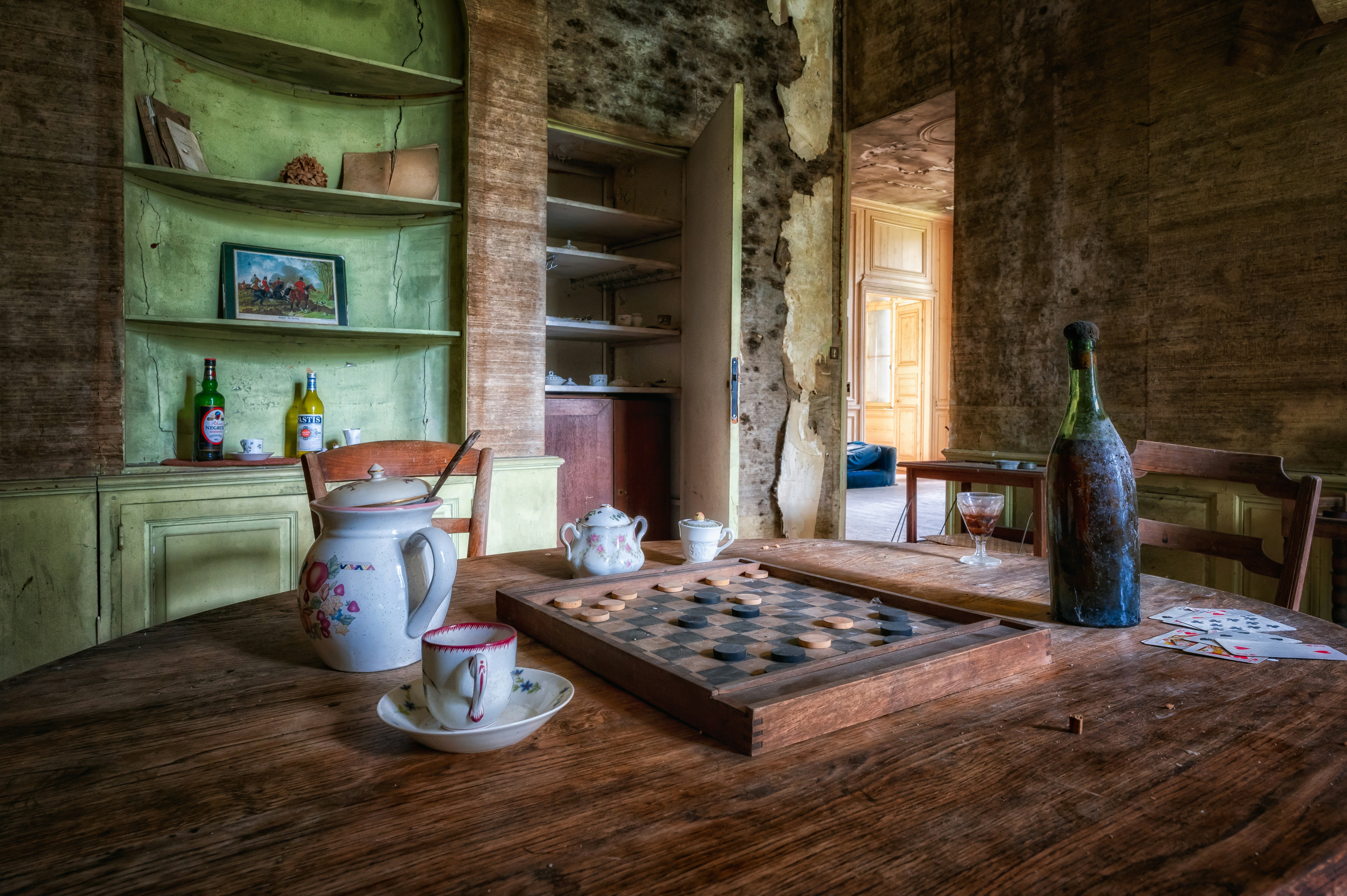 white ceramic teapot on brown wooden table